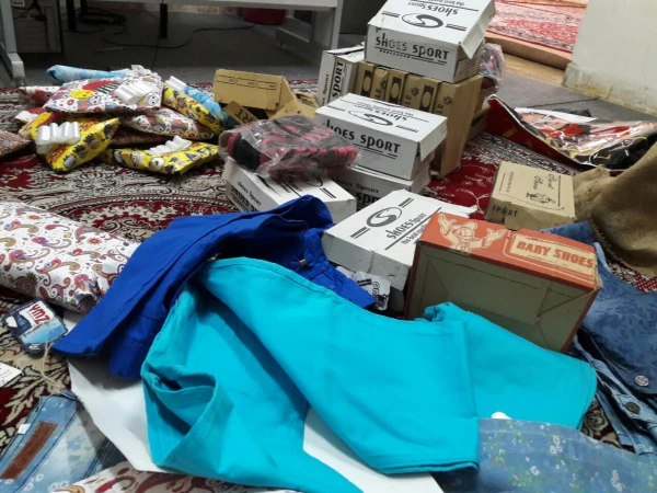 تهیه و توزیع لباس و کفش بین دختران بی سرپرست و بدسرپرست از طریق کمپین دانشجویی «دستان مهربانی» 2